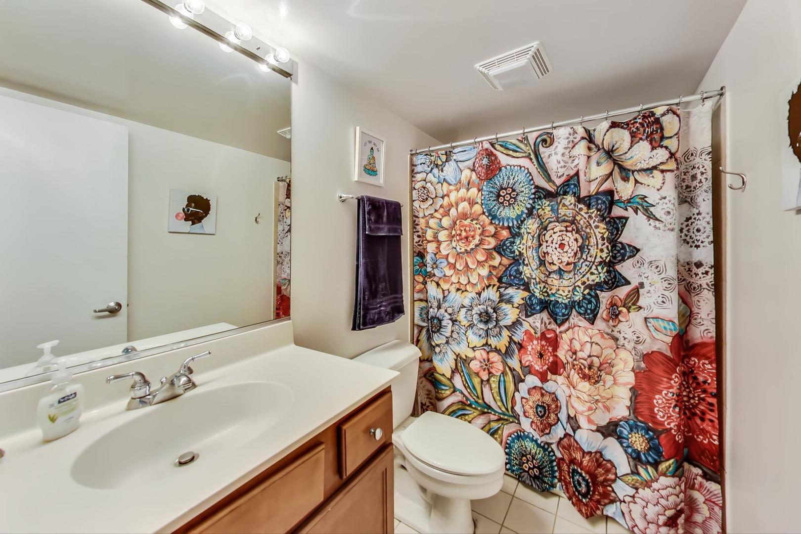 1111 West 15th Street, Unit 221 Chicago, IL 60608 - Photo 15 of 21 a bathroom with a sink toilet and shower