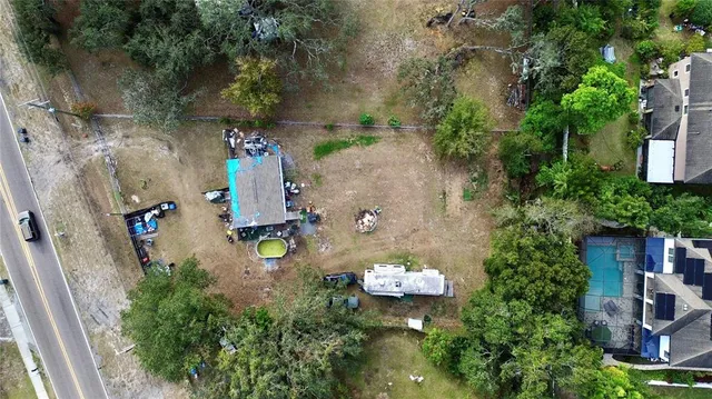 an aerial view of a house with outdoor space