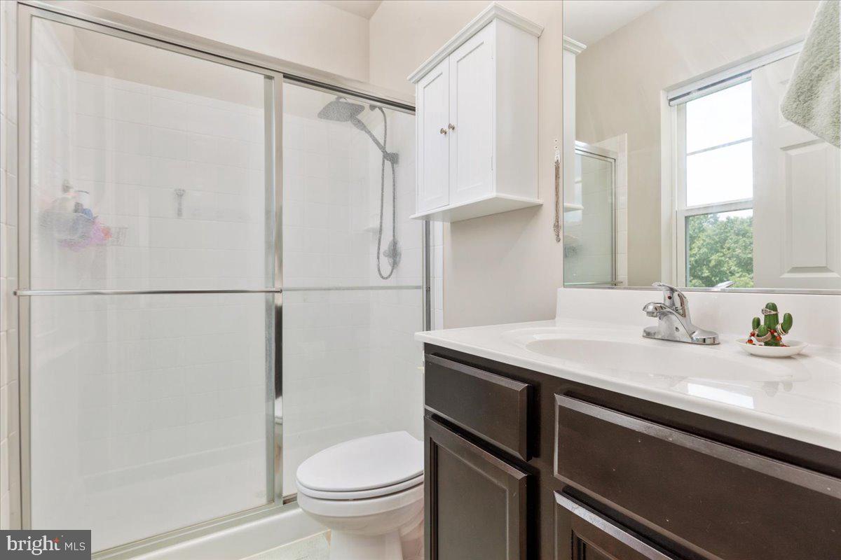 267 Patchwork Drive Stephenson, VA 22656 - Photo 19 of 41 a bathroom with a granite countertop sink toilet and shower
