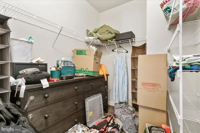 a bed room with a bed and a chandelier