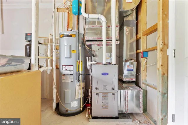 a room with water heater and a window