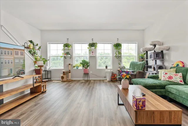 a living room with furniture and a large window