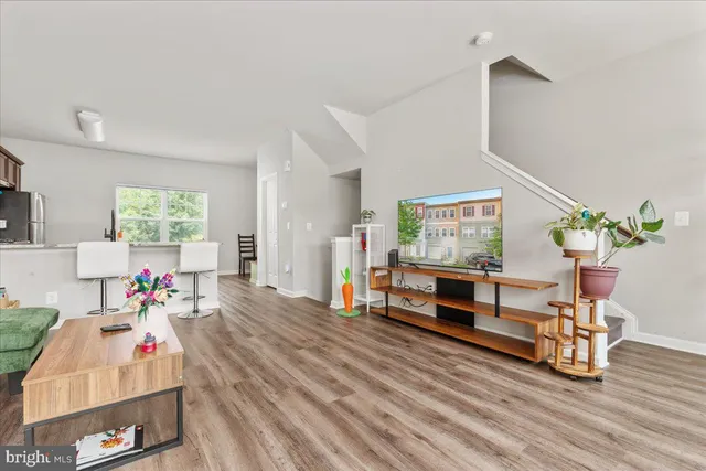 a bedroom with furniture and wooden floor