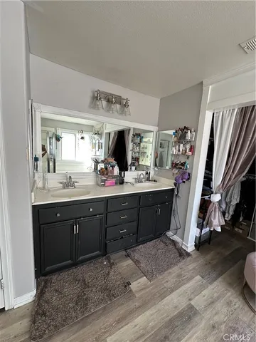 a room with a dresser and a window