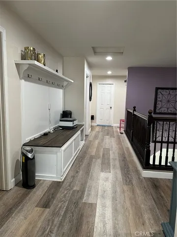 a view of kitchen with sink and wooden floor