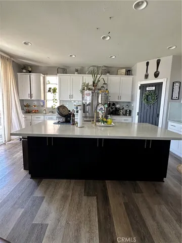 a kitchen with sink and cabinets