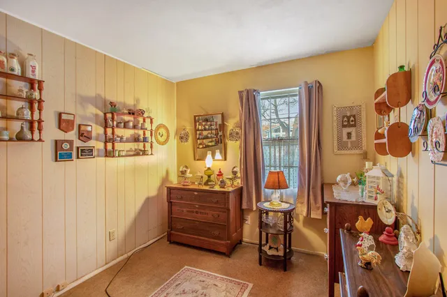 a bedroom with a bed and furniture