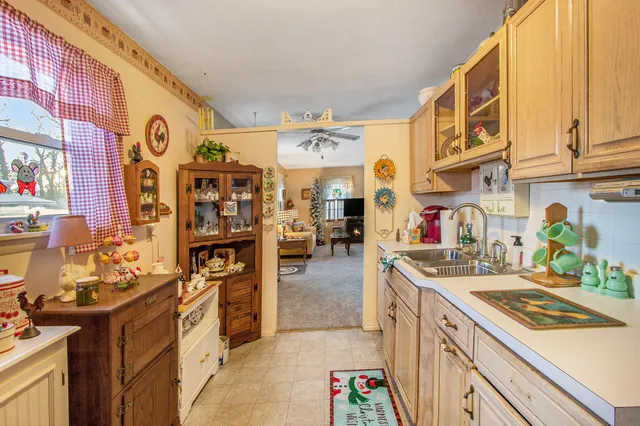 a kitchen with a sink and a stove top oven