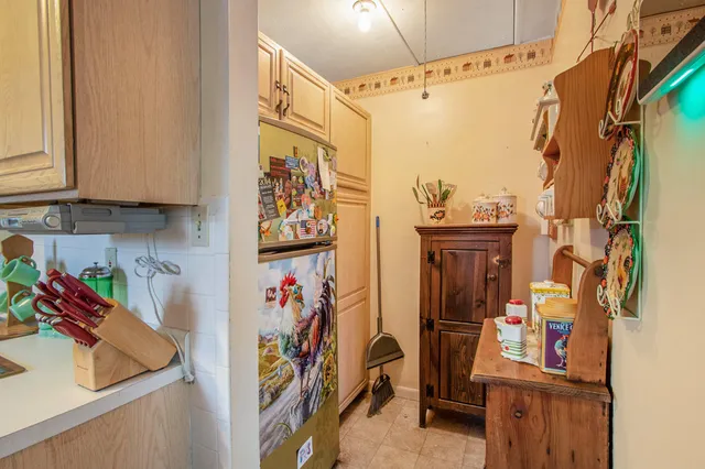 a view of walk in closet with clothes