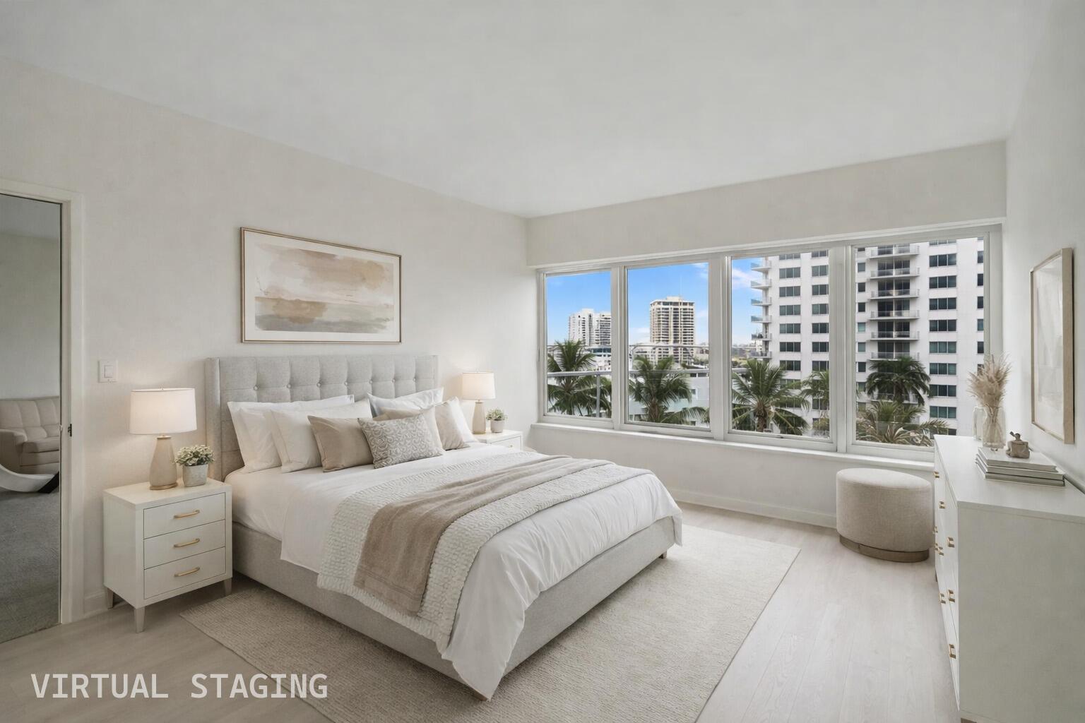 701 East Camino Real, Unit 6C Boca Raton, FL 33432 - Photo 11 of 53 a bedroom with a large bed and a large window
