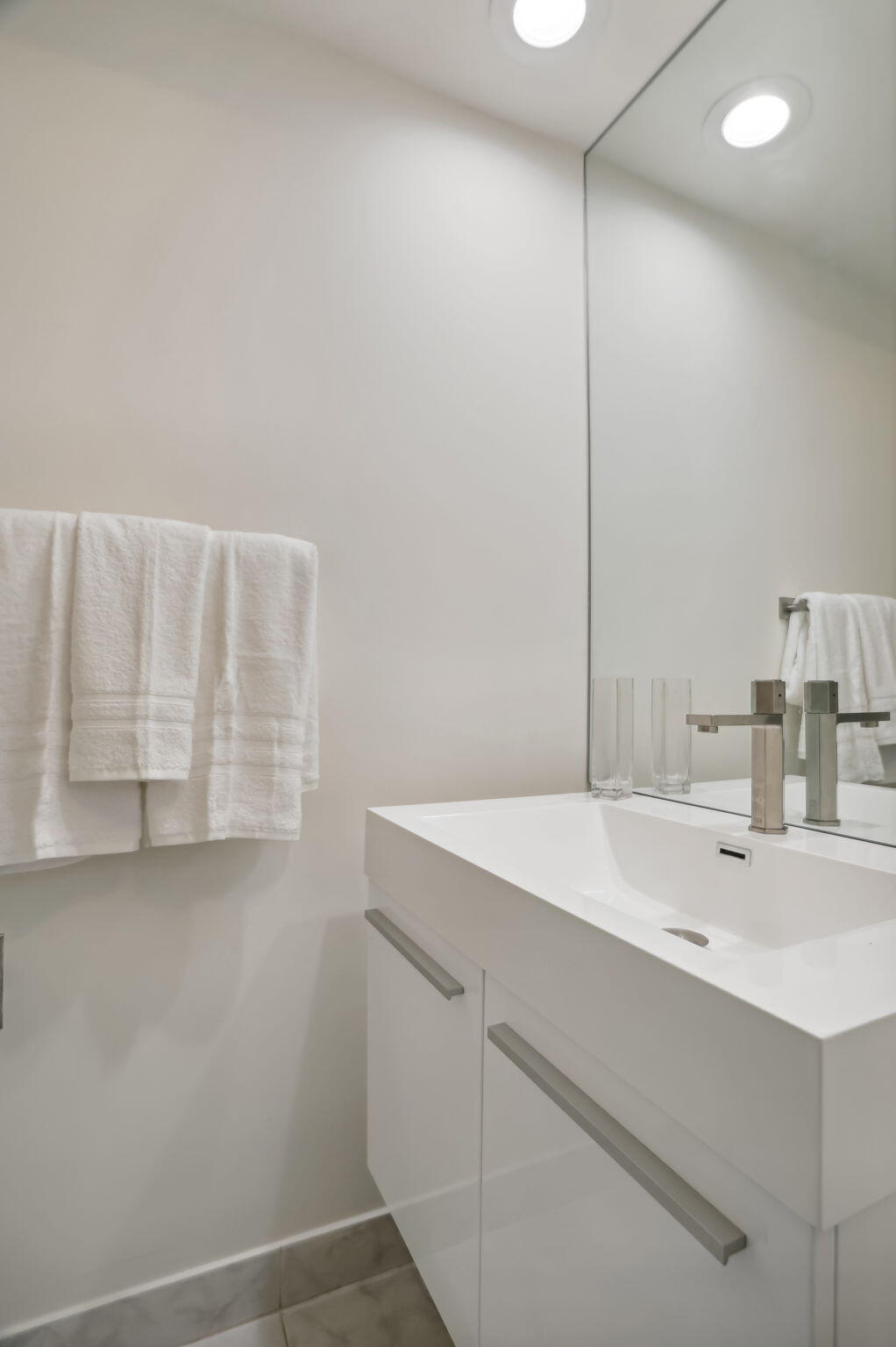 701 East Camino Real, Unit 6C Boca Raton, FL 33432 - Photo 14 of 53 a bathroom with a sink and a mirror
