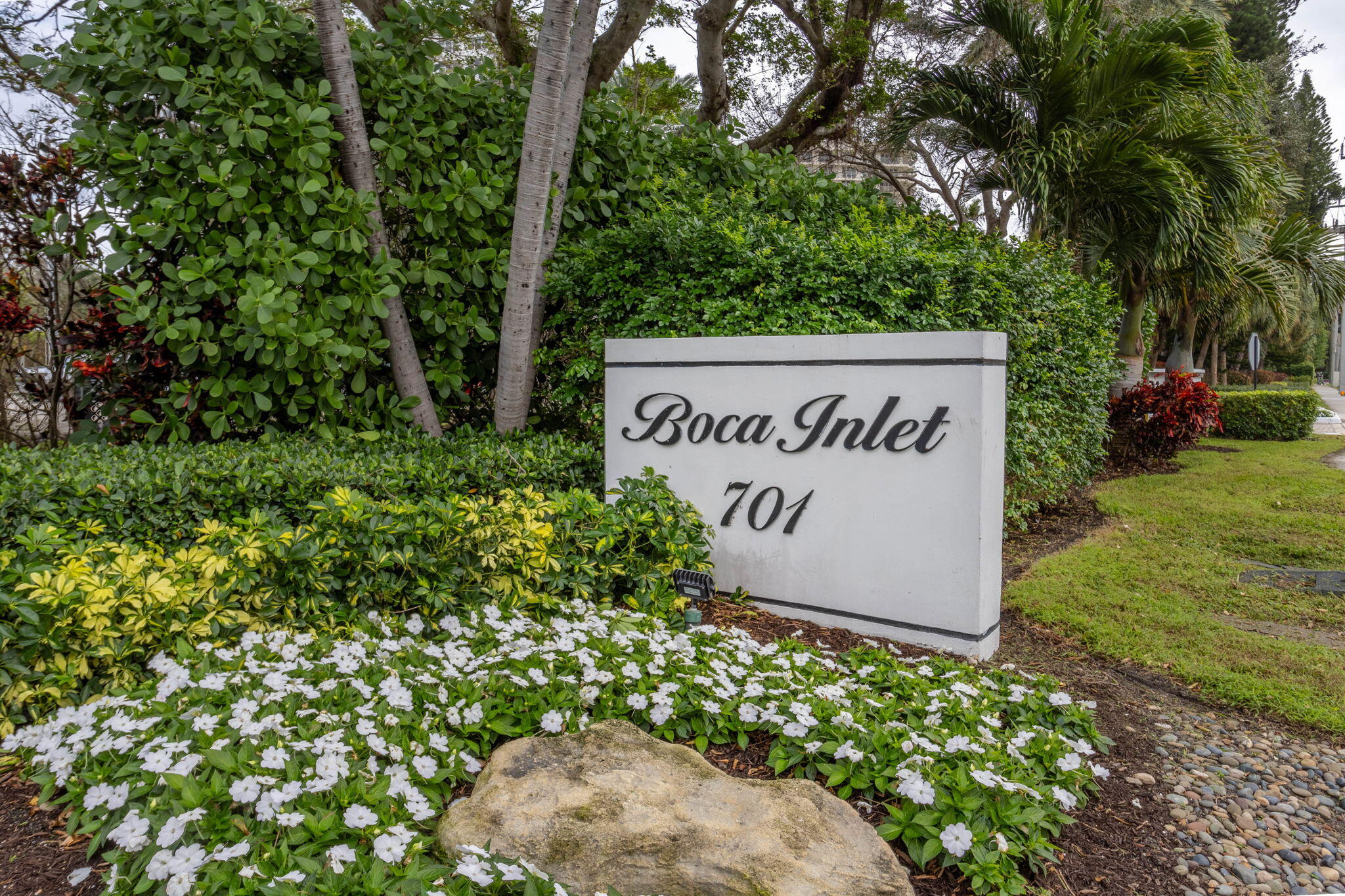 701 East Camino Real, Unit 6C Boca Raton, FL 33432 - Photo 33 of 53 a sign on the side of the road