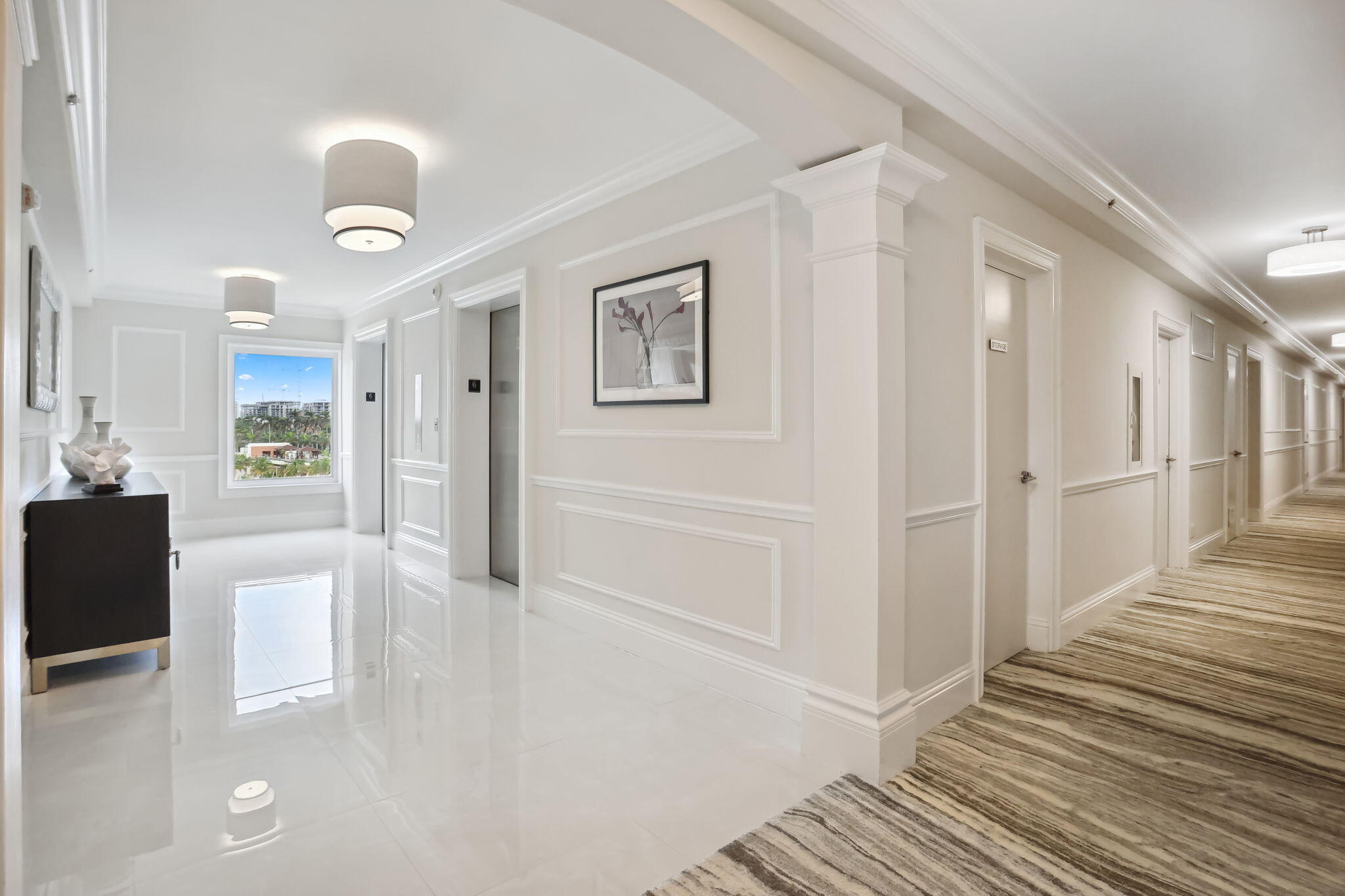 701 East Camino Real, Unit 6C Boca Raton, FL 33432 - Photo 34 of 53 a view of a hallway with wooden floor and cabinet