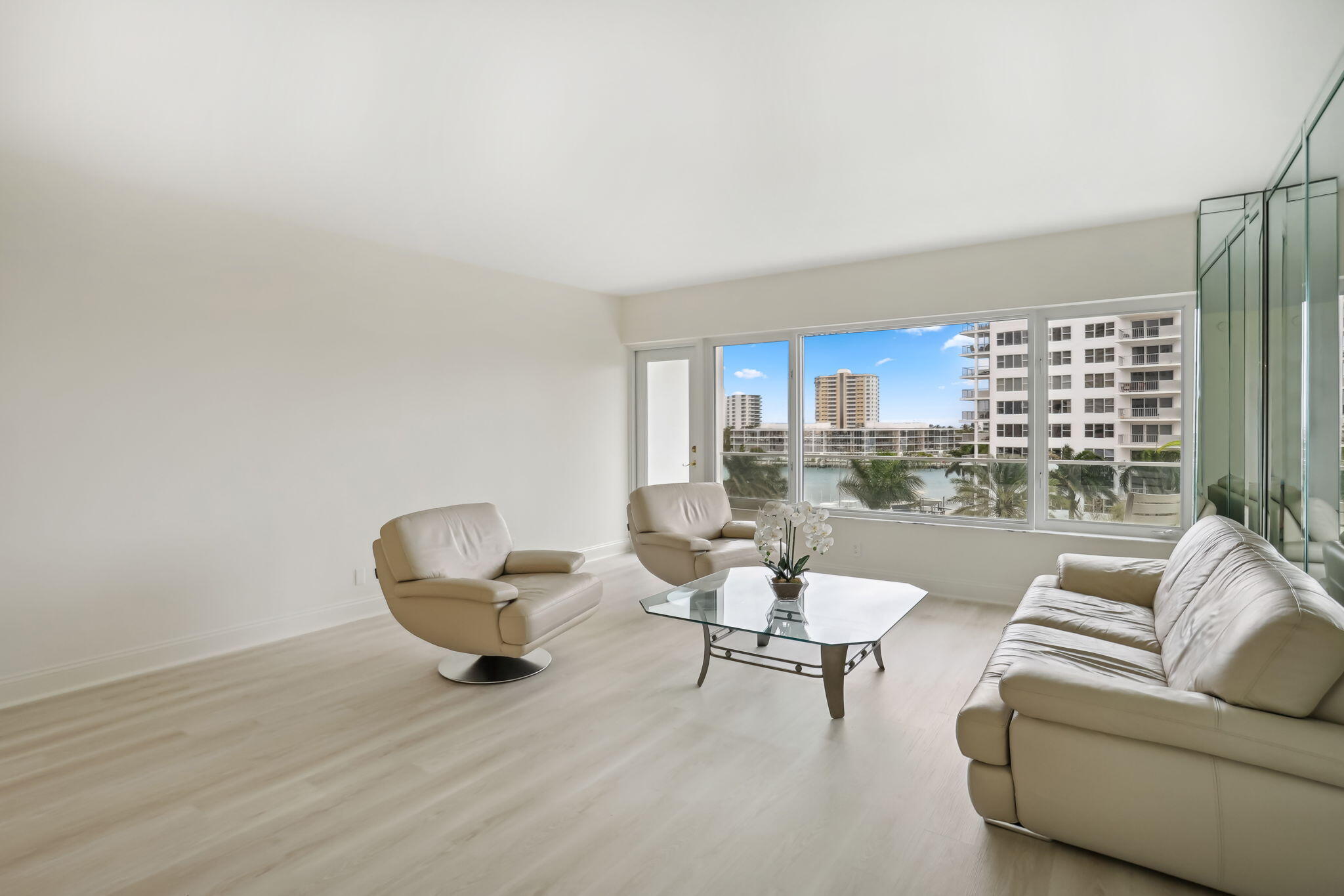 701 East Camino Real, Unit 6C Boca Raton, FL 33432 - Photo 4 of 53 a living room with furniture and a large window