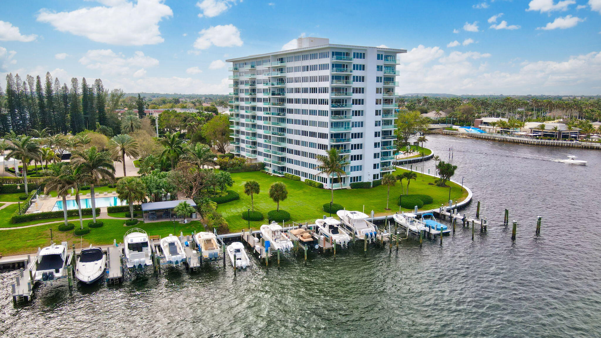 701 East Camino Real, Unit 6C Boca Raton, FL 33432 - Photo 47 of 53 a view of a lake with a yard and a fountain