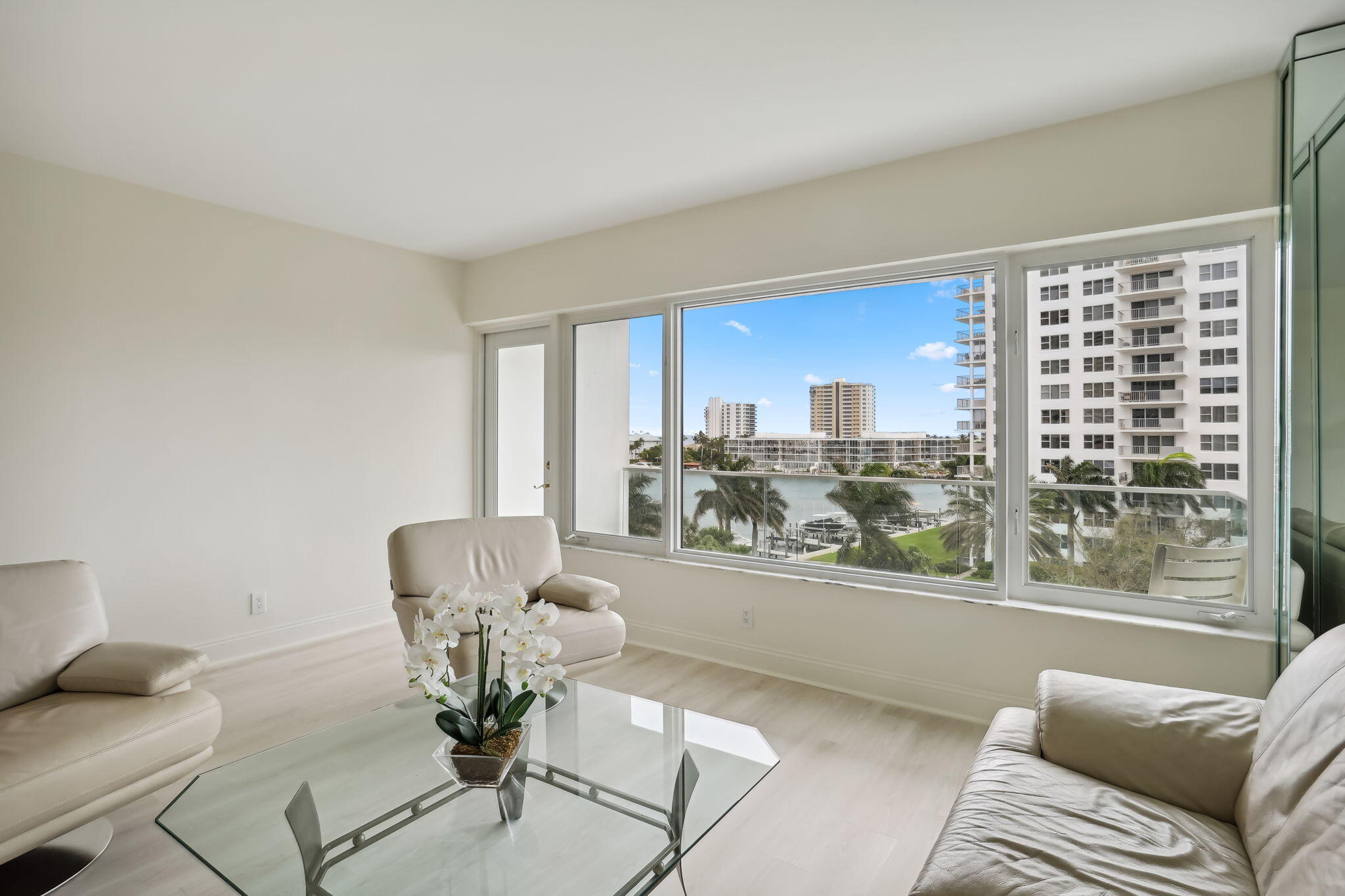 701 East Camino Real, Unit 6C Boca Raton, FL 33432 - Photo 7 of 53 a living room with furniture and a large window