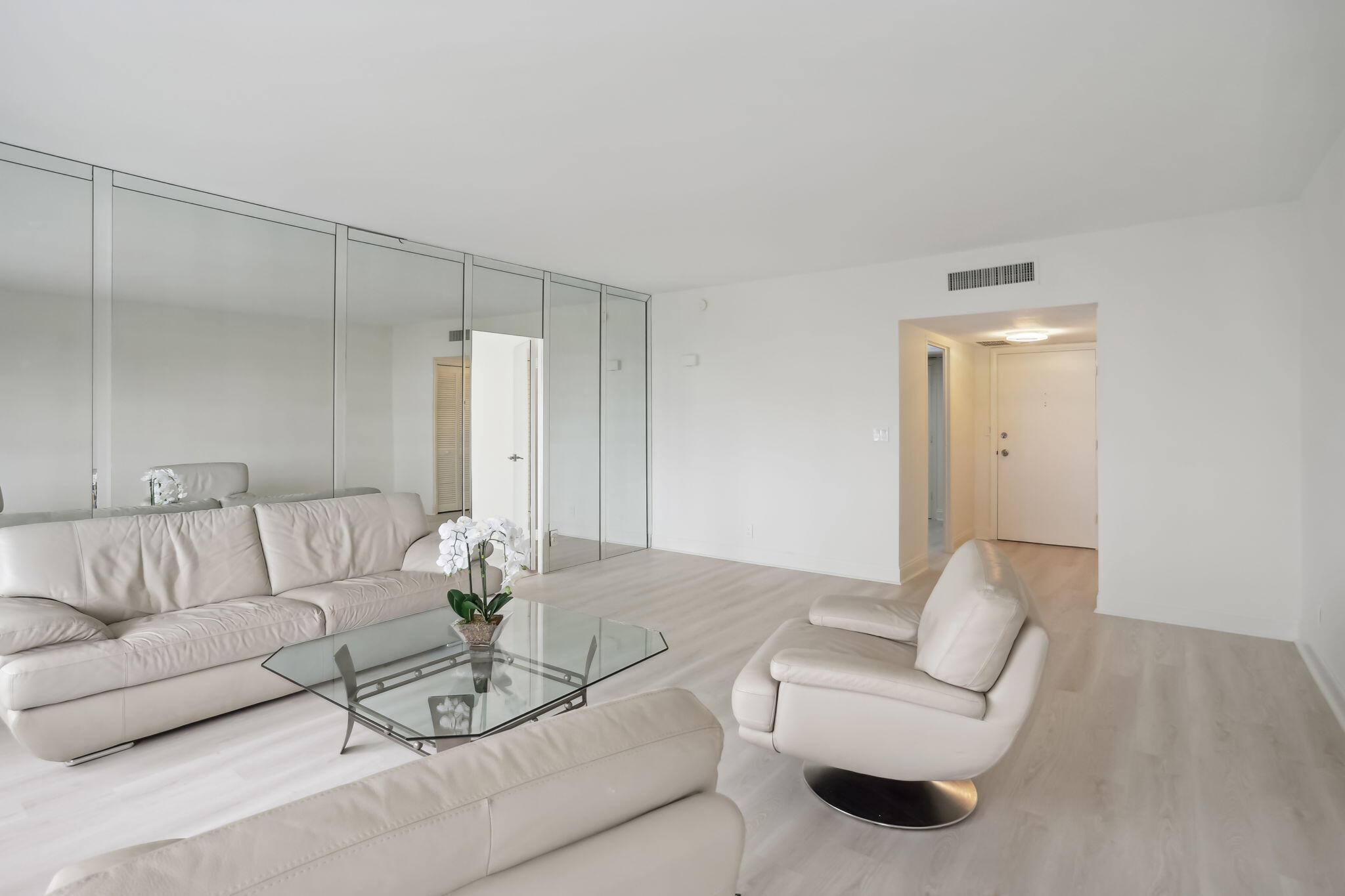 701 East Camino Real, Unit 6C Boca Raton, FL 33432 - Photo 9 of 53 a living room with furniture and a white couch