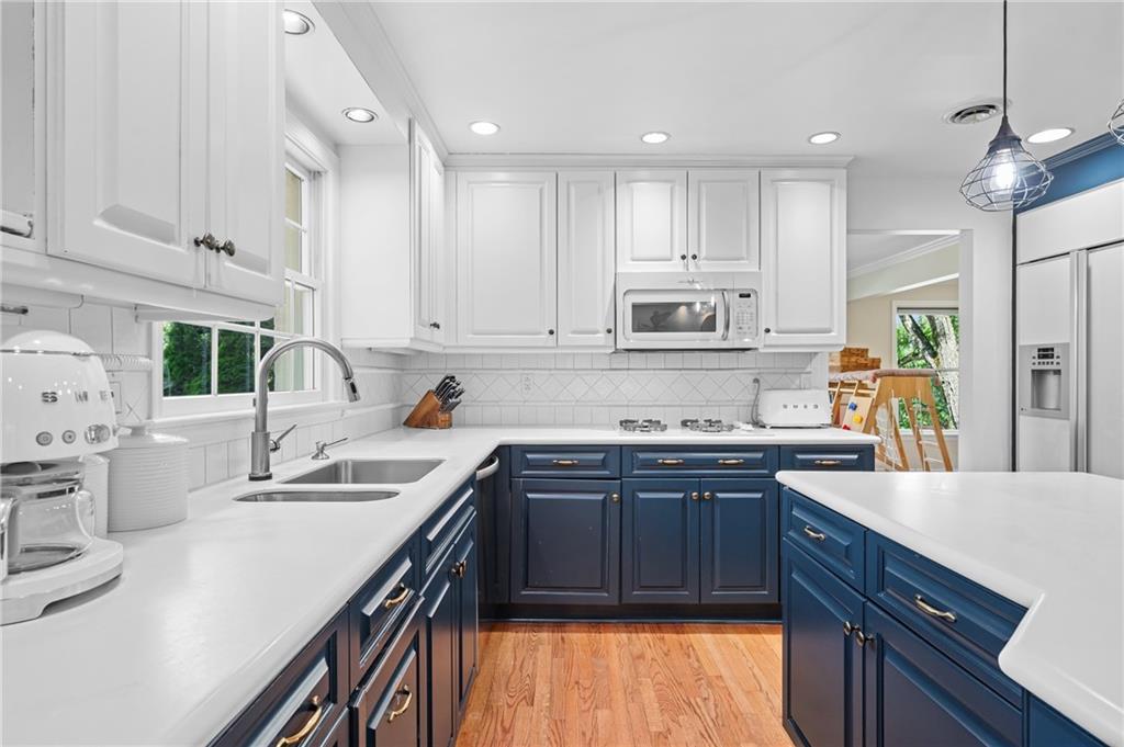 323 Cornwall Drive Pittsburgh, PA 15238 - Photo 12 of 41 a kitchen with kitchen island granite countertop a sink counter top space appliances and cabinets