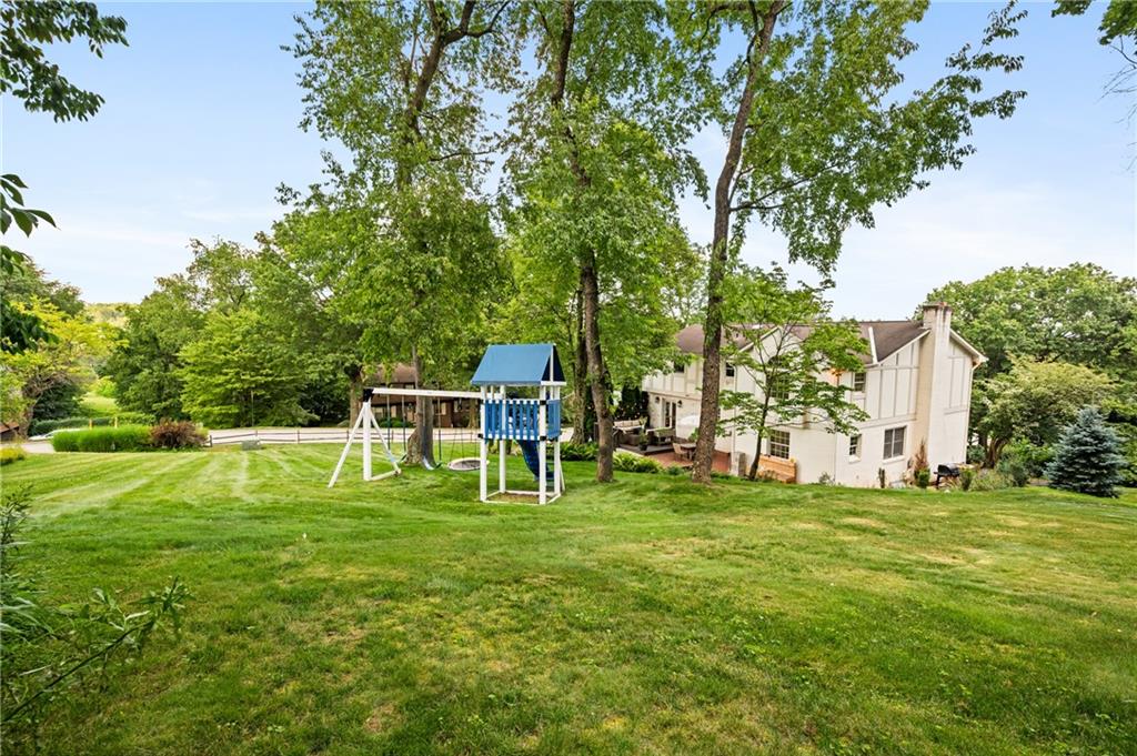 323 Cornwall Drive Pittsburgh, PA 15238 - Photo 2 of 41 a white house with a big yard and large trees