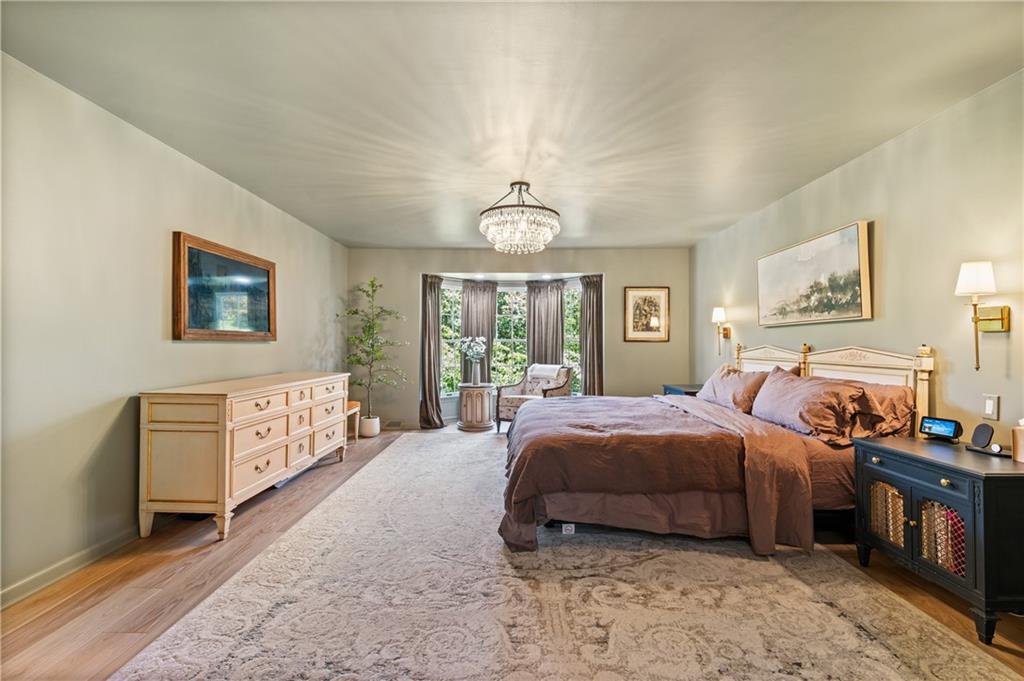 323 Cornwall Drive Pittsburgh, PA 15238 - Photo 22 of 41 a spacious bedroom with a bed a dresser next to a window