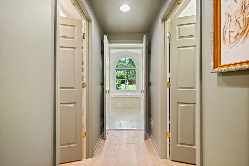 323 Cornwall Drive Pittsburgh, PA 15238 - Photo 24 of 41 a view of a hallway with wooden floor and a dining room