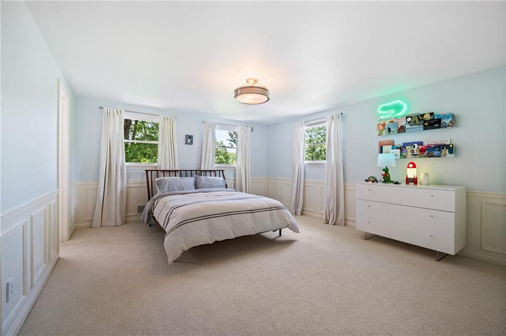 323 Cornwall Drive Pittsburgh, PA 15238 - Photo 27 of 41 a bedroom with a bed and a dresser in it