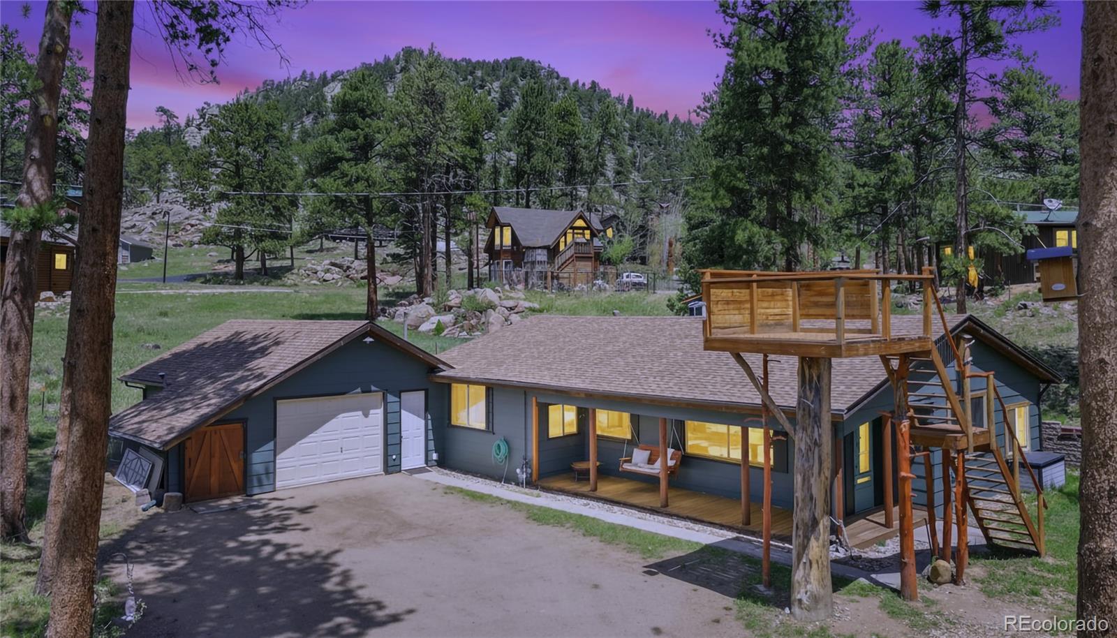 810 Larkspur Road Estes Park, CO 80517 - Photo 2 of 44 a view of a house with a yard balcony and tree