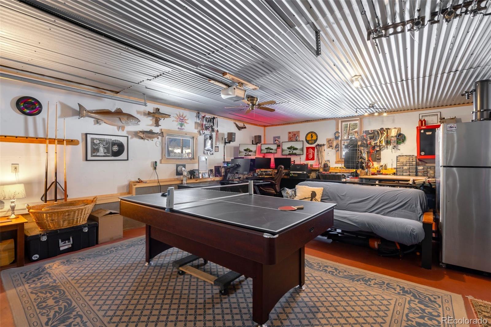 810 Larkspur Road Estes Park, CO 80517 - Photo 27 of 44 a living room filled with furniture and a table