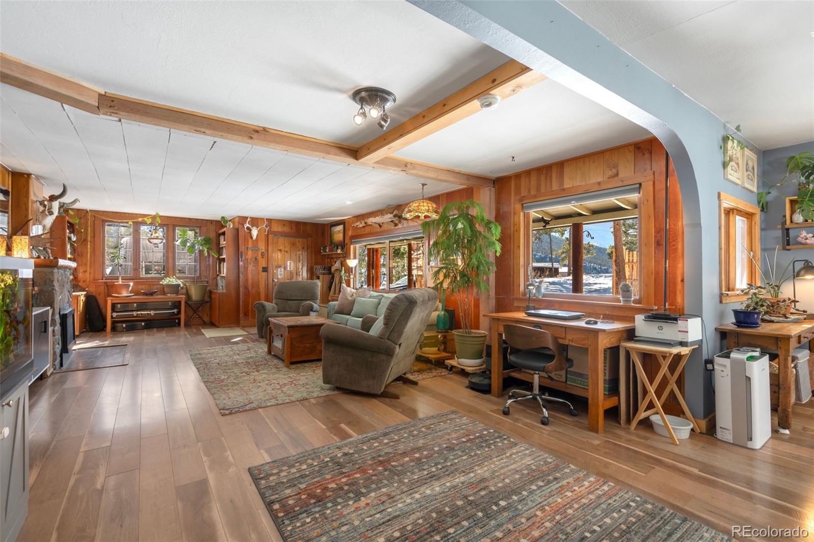 810 Larkspur Road Estes Park, CO 80517 - Photo 9 of 44 a living room with furniture and a large window