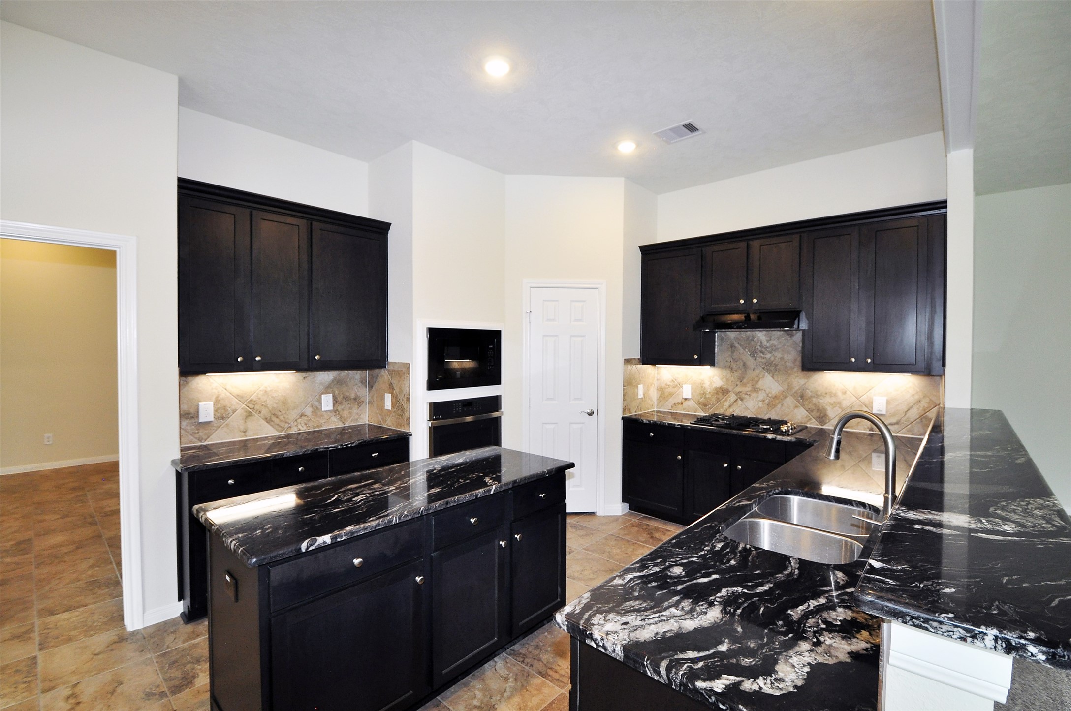 3708 Pedregal Road League City, TX 77573 - Photo 12 of 50 a kitchen with a stove and a refrigerator