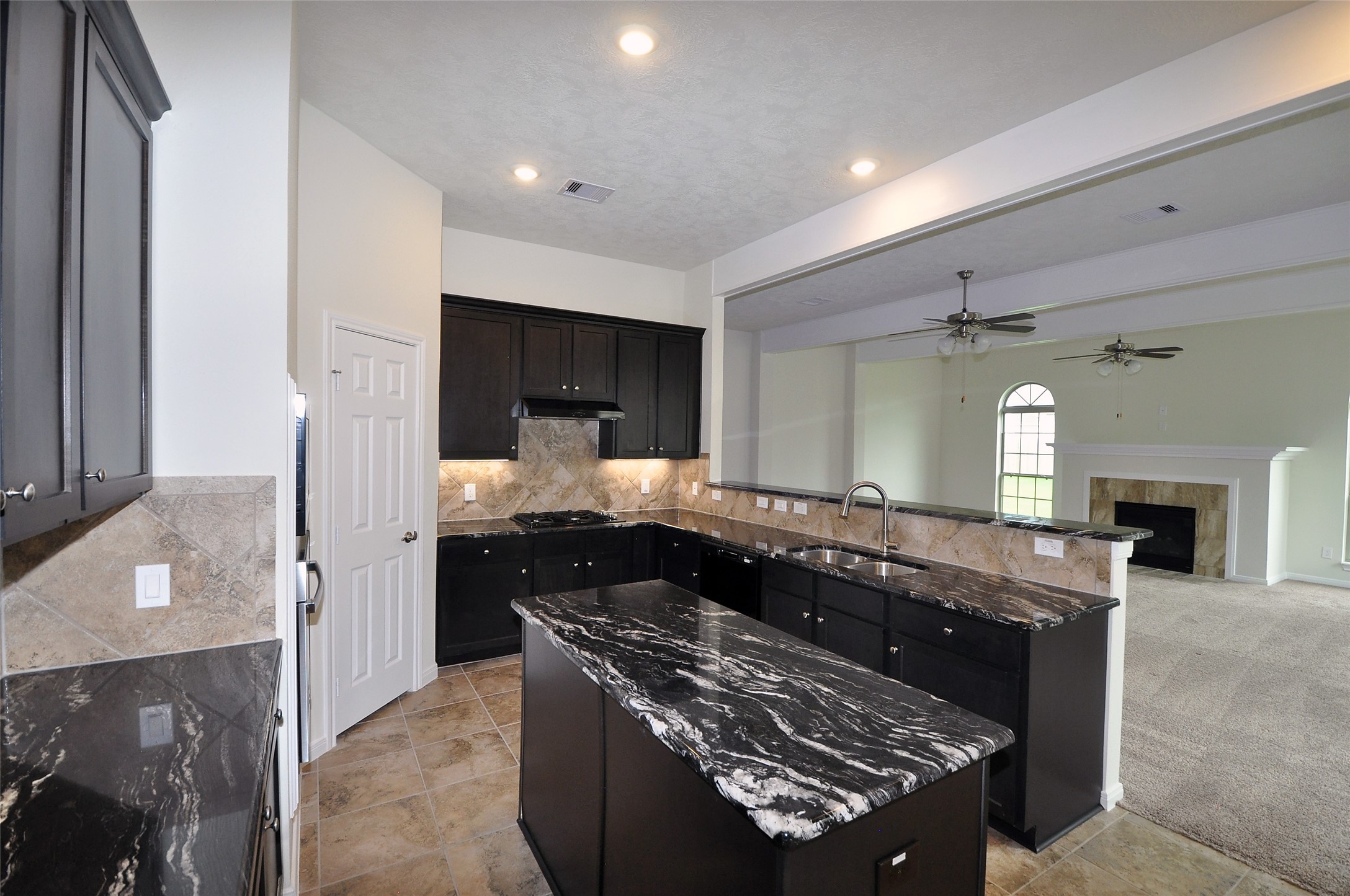 3708 Pedregal Road League City, TX 77573 - Photo 13 of 50 a kitchen with a stove and a wooden floors