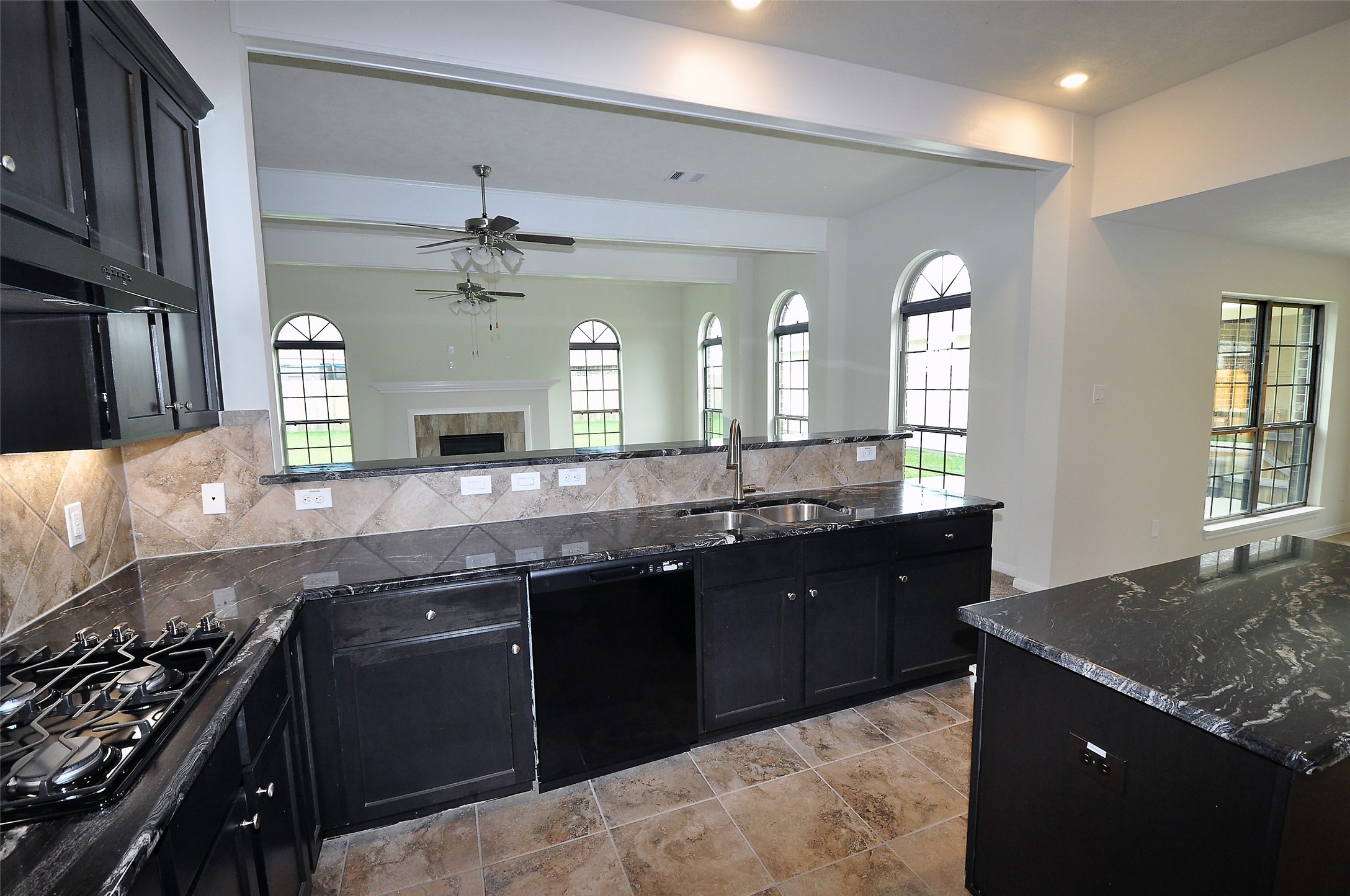 3708 Pedregal Road League City, TX 77573 - Photo 14 of 50 a kitchen with a sink stove and cabinets