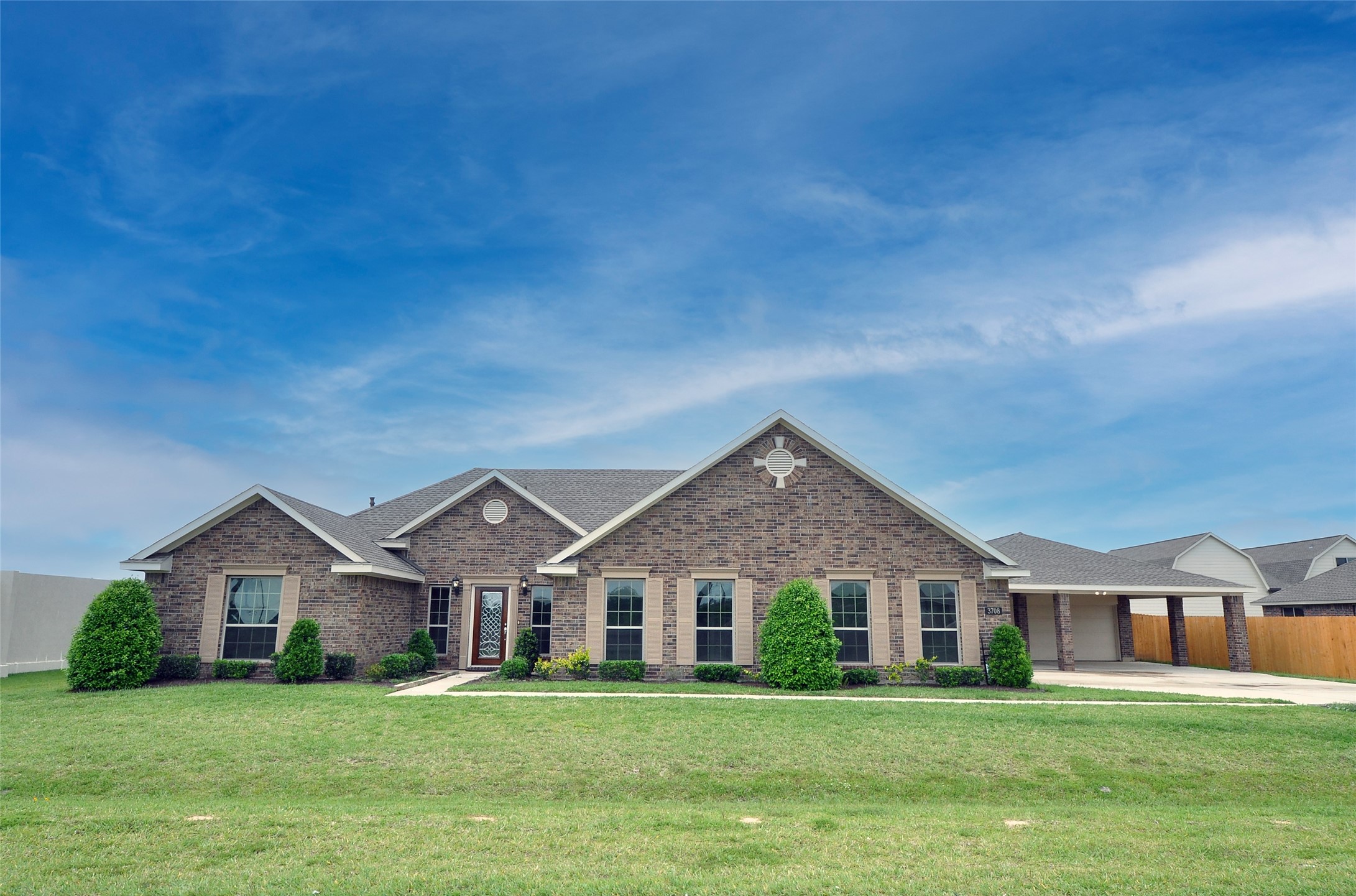 3708 Pedregal Road League City, TX 77573 - Photo 2 of 50 a front view of a house with a yard and trees
