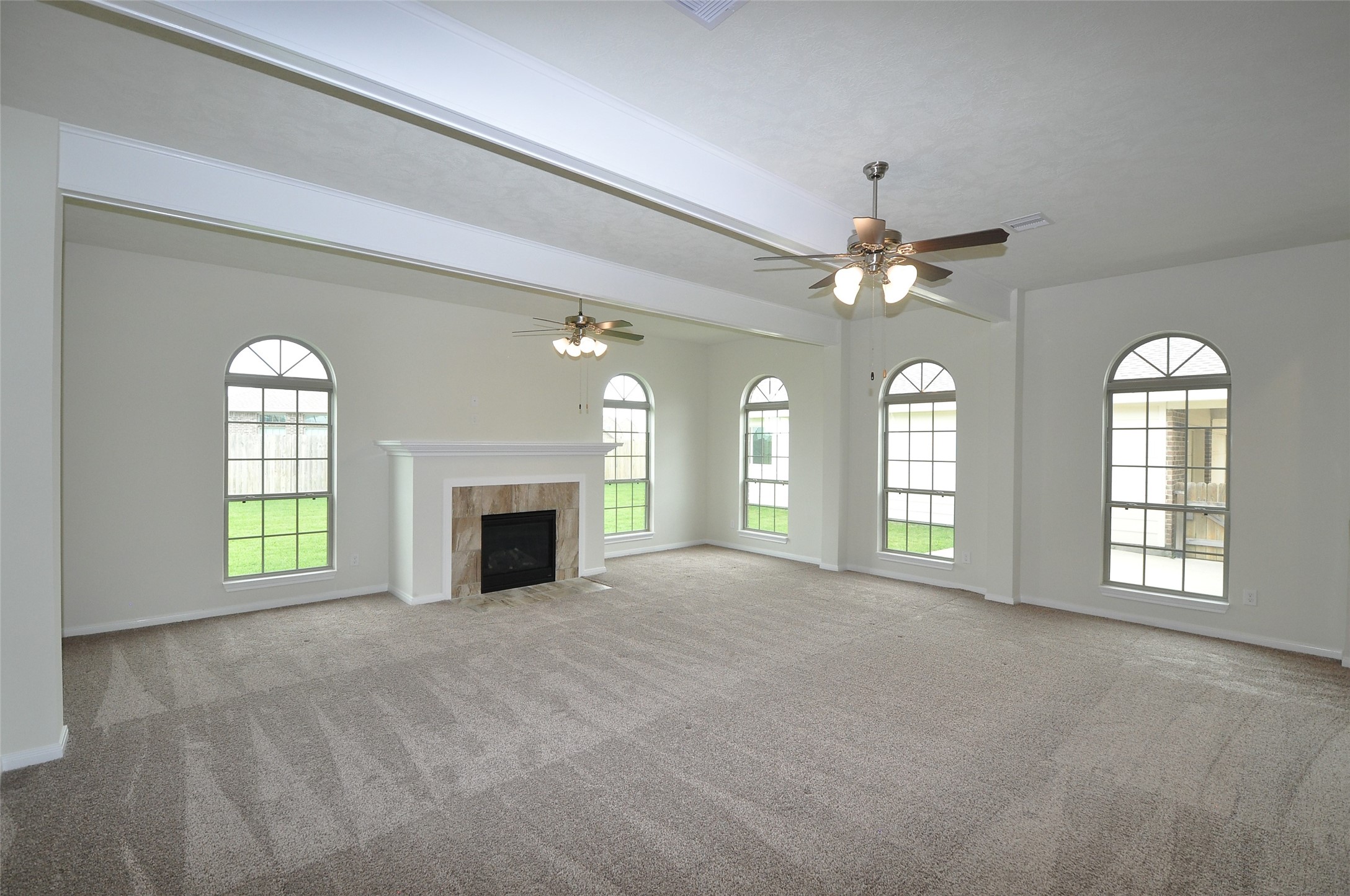 3708 Pedregal Road League City, TX 77573 - Photo 22 of 50 a view of an empty room with a fireplace and a window