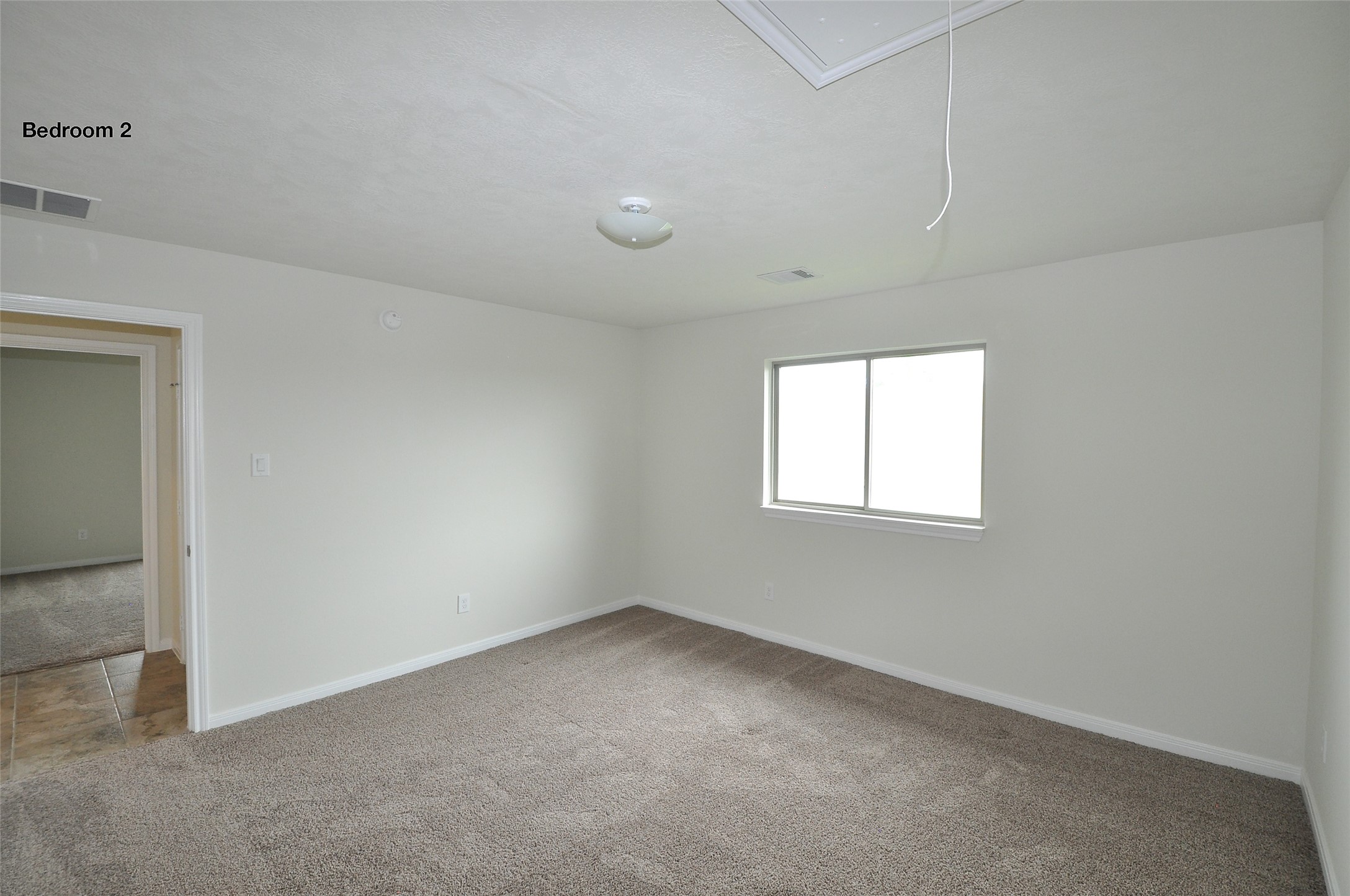 3708 Pedregal Road League City, TX 77573 - Photo 32 of 50 an empty room with a window