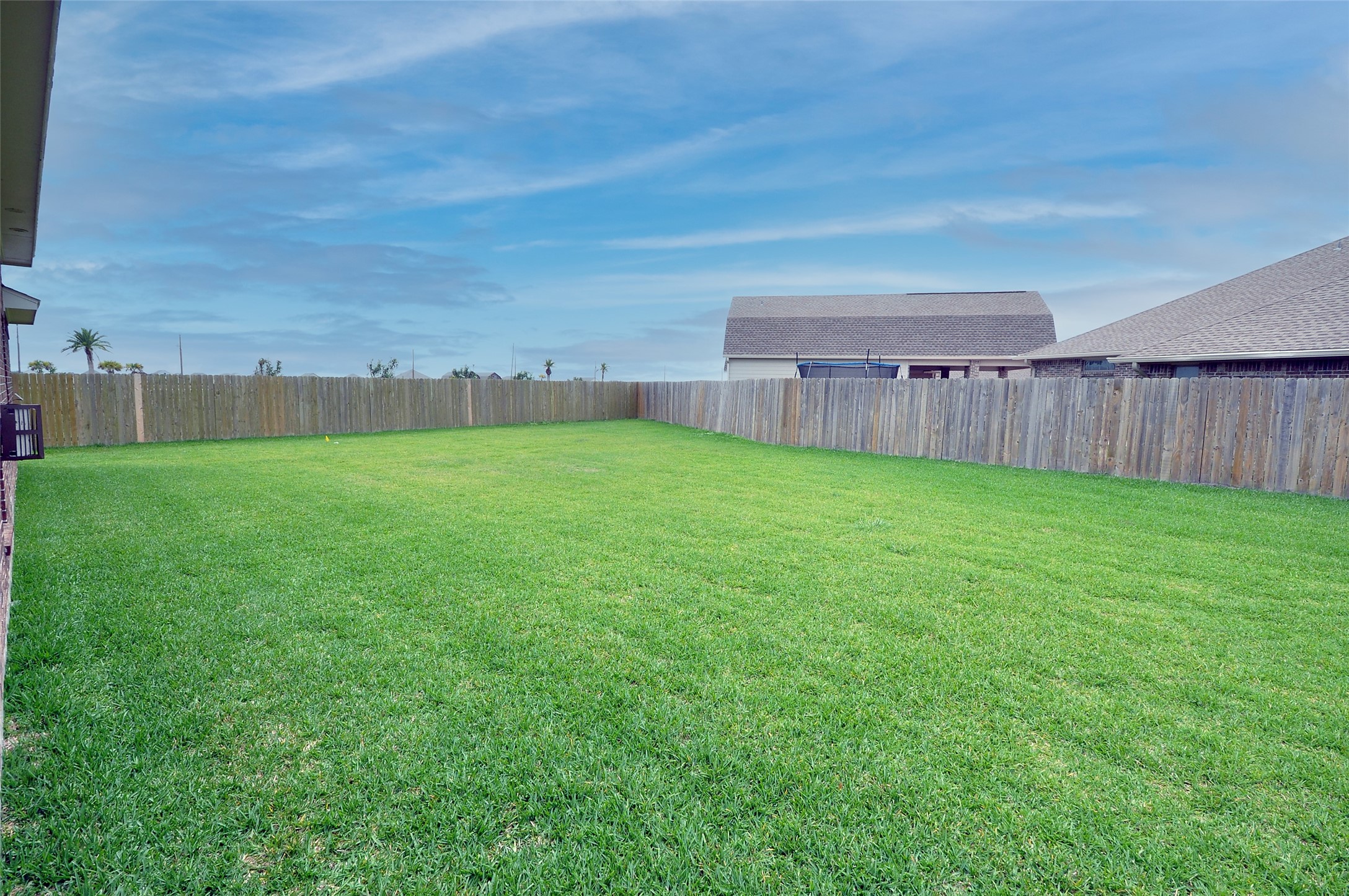 3708 Pedregal Road League City, TX 77573 - Photo 46 of 50 a view of a backyard with a barbeque and wooden fence