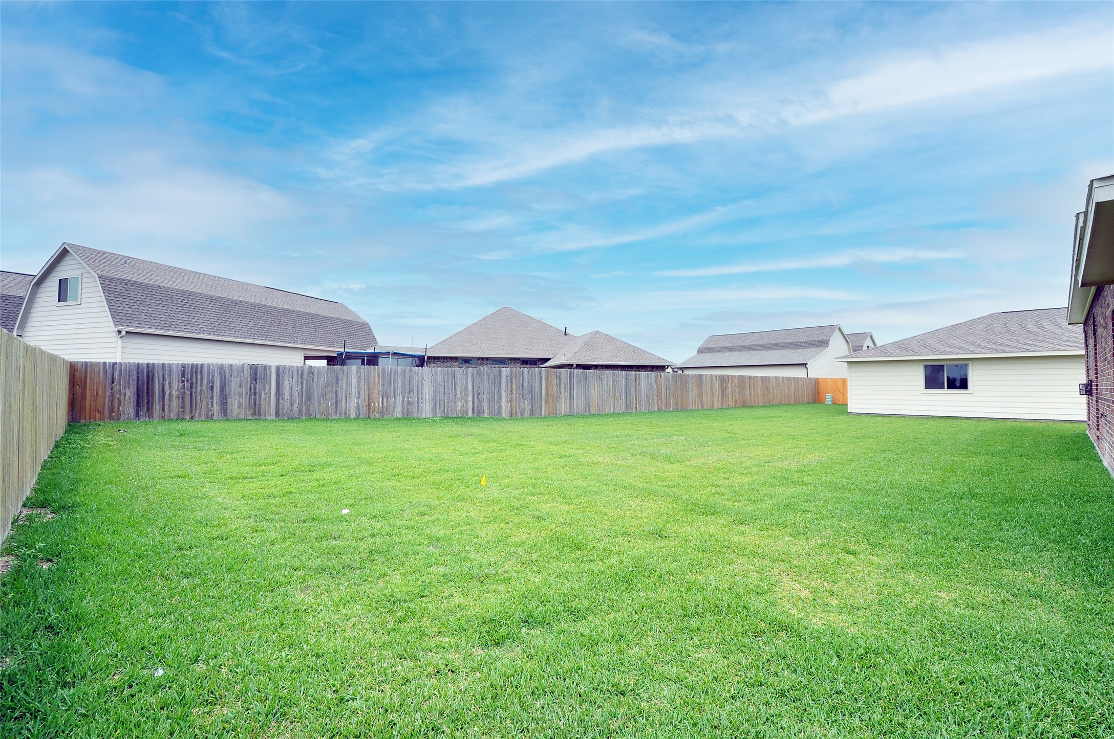 3708 Pedregal Road League City, TX 77573 - Photo 50 of 50 a view of a house with a big yard and wooden fence