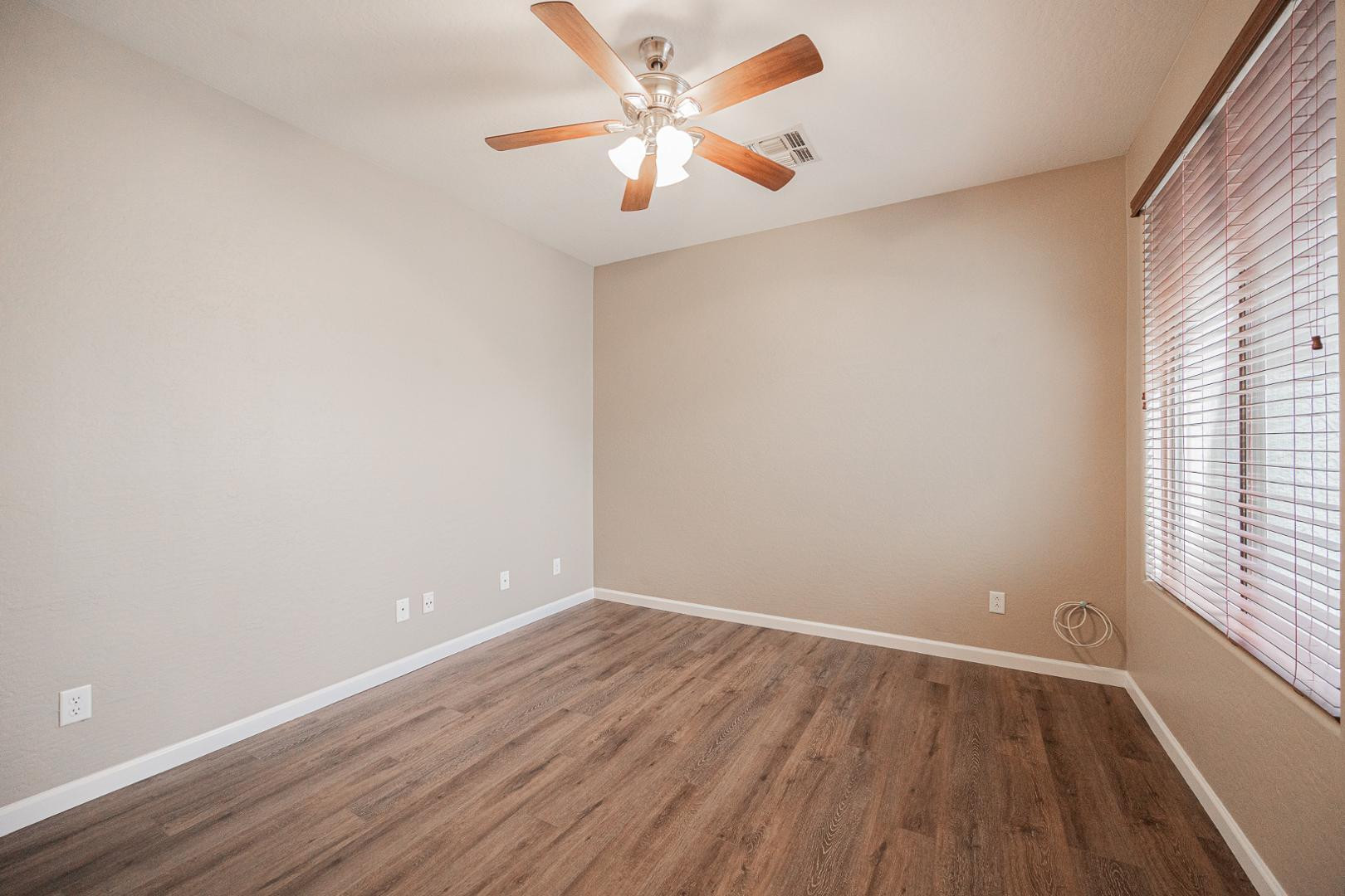 6539 West Jomax Road Phoenix, AZ 85083 - Photo 27 of 39 wooden floor in an empty room with a window