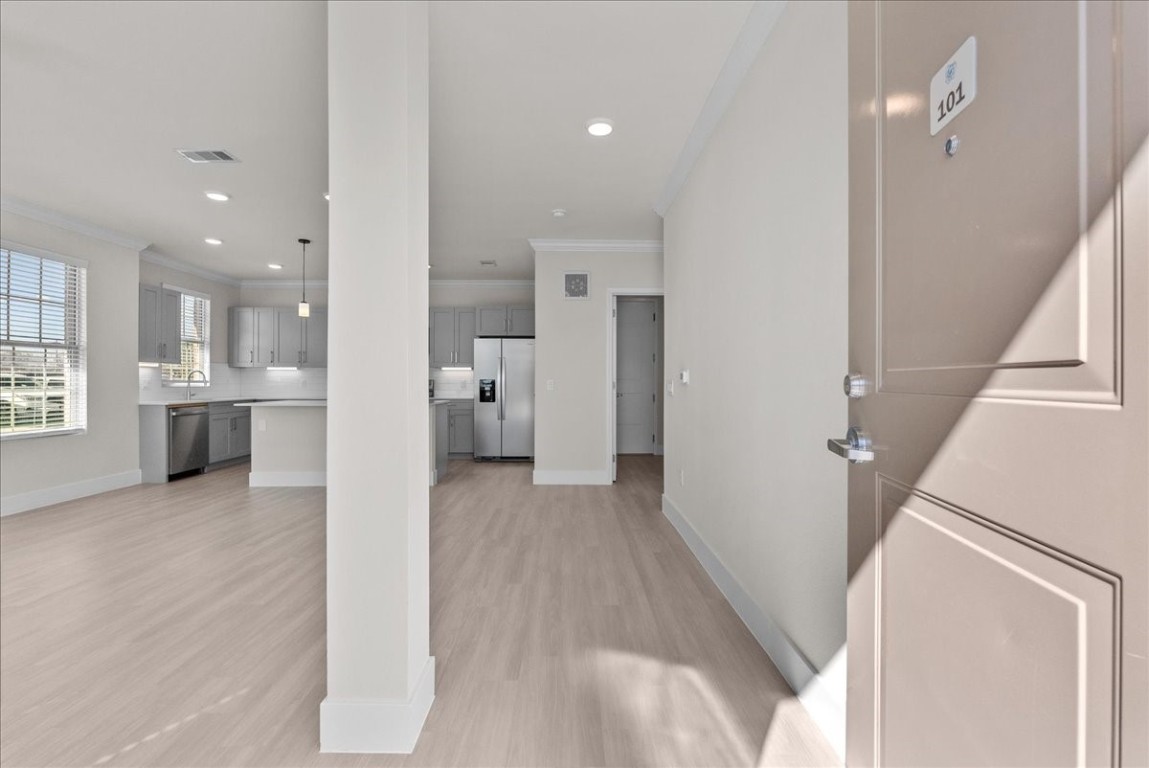 540 Hobbs Road, Unit A1 League City, TX 77573 - Photo 2 of 40 a view of a kitchen with a sink and a refrigerator