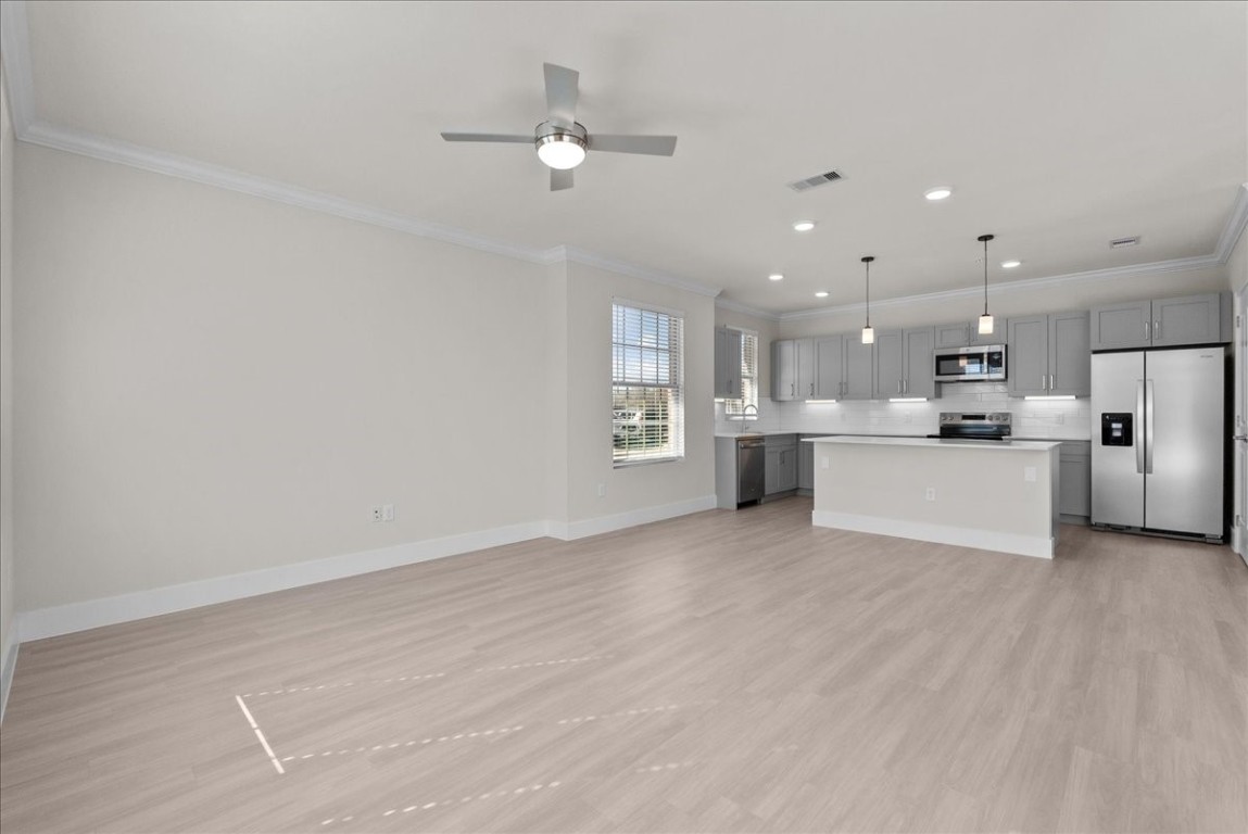 540 Hobbs Road, Unit A1 League City, TX 77573 - Photo 3 of 40 a view of a kitchen with a sink and white cabinets