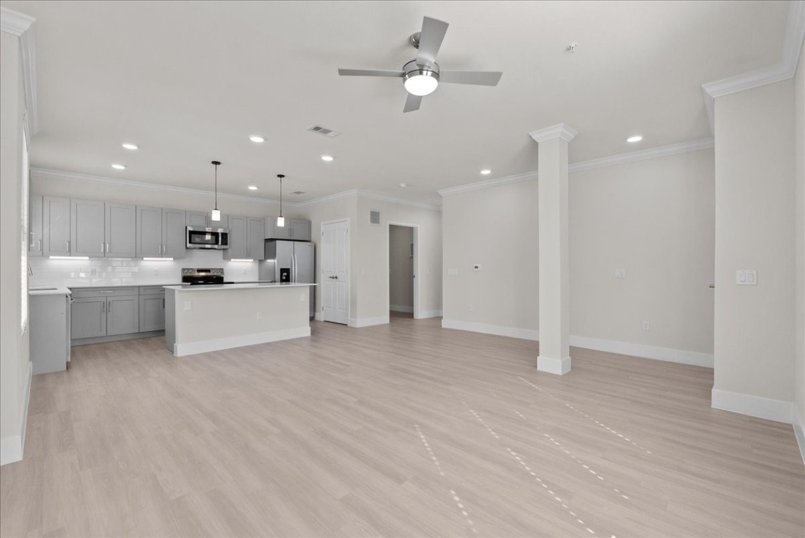 540 Hobbs Road, Unit A1 League City, TX 77573 - Photo 4 of 40 a view of a kitchen with a sink and a refrigerator