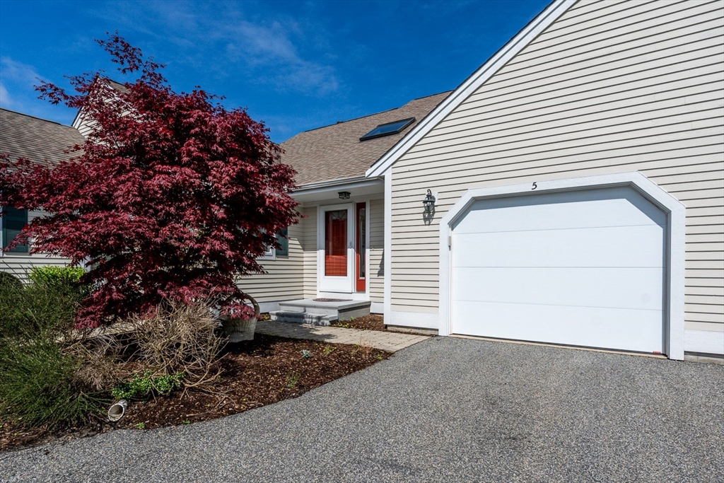 5 Classic Circle, Unit 484 Mashpee, MA 02649 - Photo 1 of 18 a view of a house with a garage