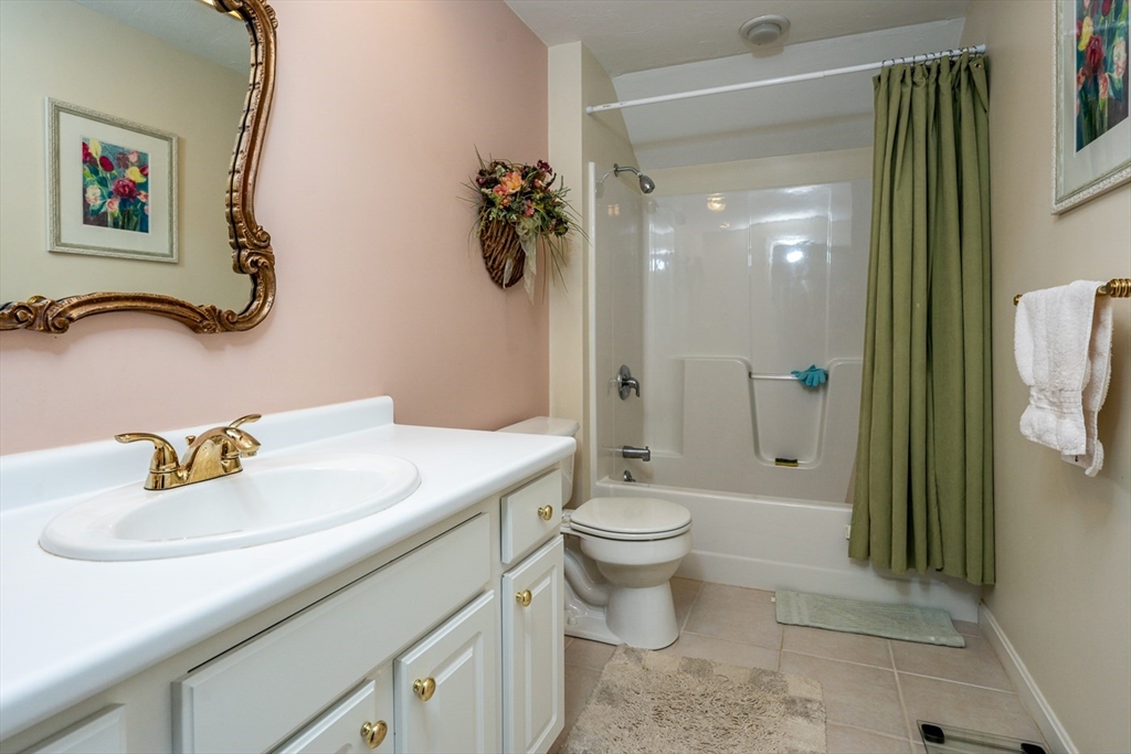 5 Classic Circle, Unit 484 Mashpee, MA 02649 - Photo 15 of 18 a bathroom with a sink toilet and shower