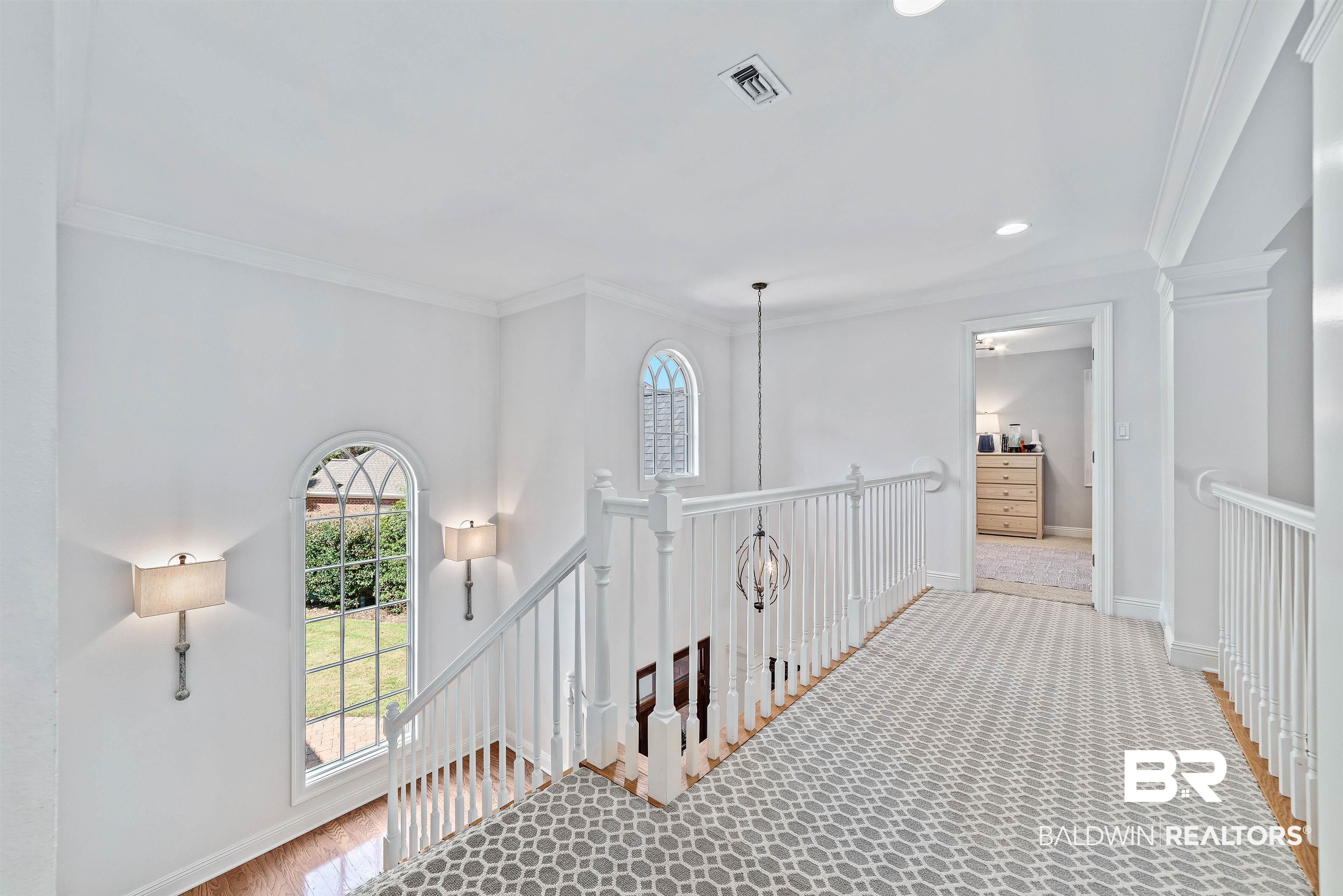 6630 East Quarry Drive Elberta, AL 36530 - Photo 38 of 63 Corridor with crown molding, wood finished floors, recessed lighting, and an upstairs landing