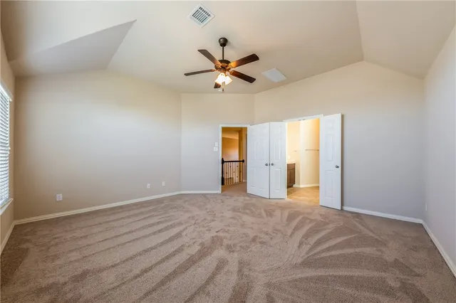 a view of a big room with carpet