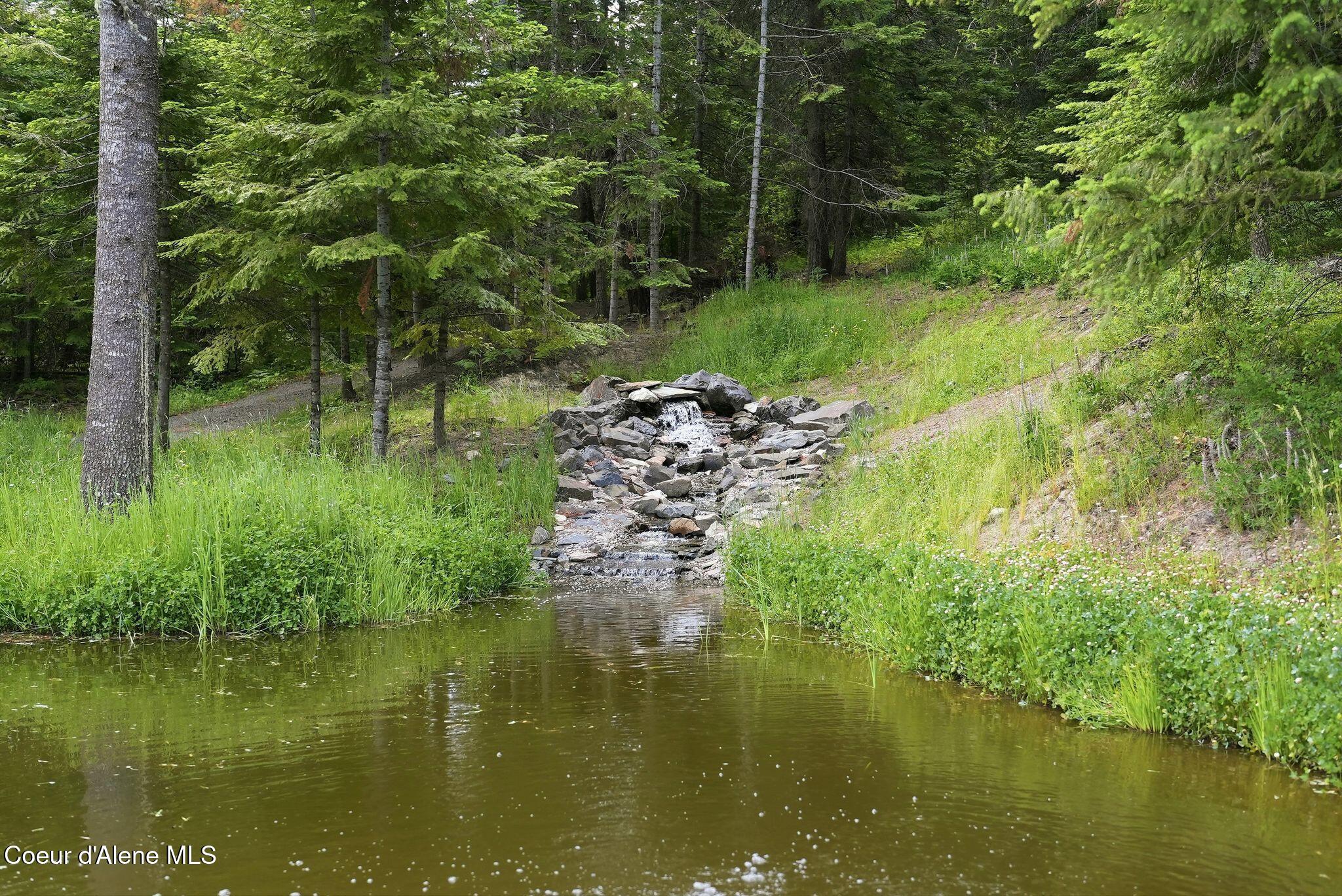 10439 West Cougar Gulch Road Coeur D'Alene, ID 83814 - Photo 87 of 128 The Waterfall & Pond at Cougar Pines