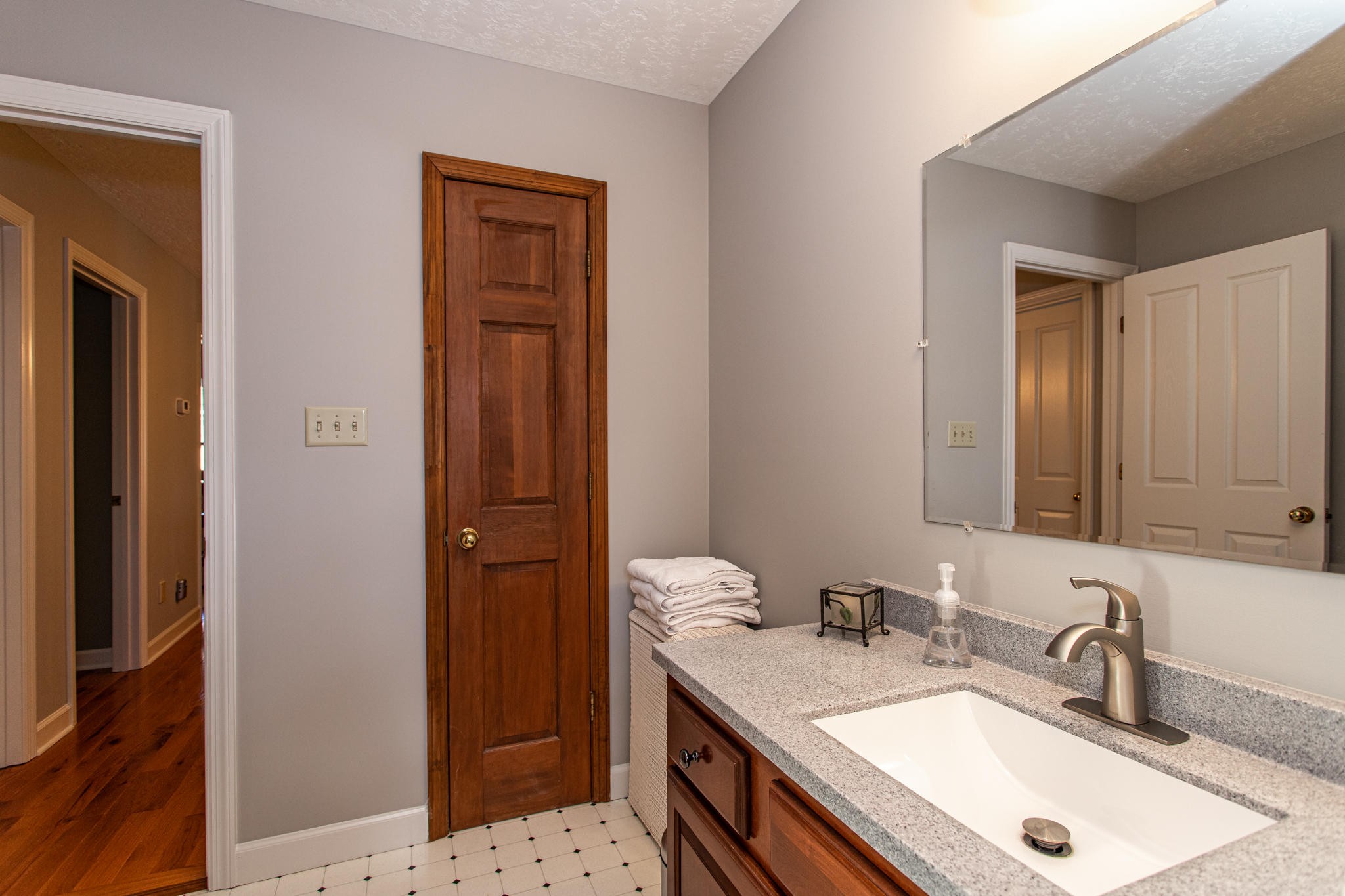 8026 Wood Road Corryton, TN 37721 - Photo 28 of 40 a bathroom with a sink a vanity and a mirror