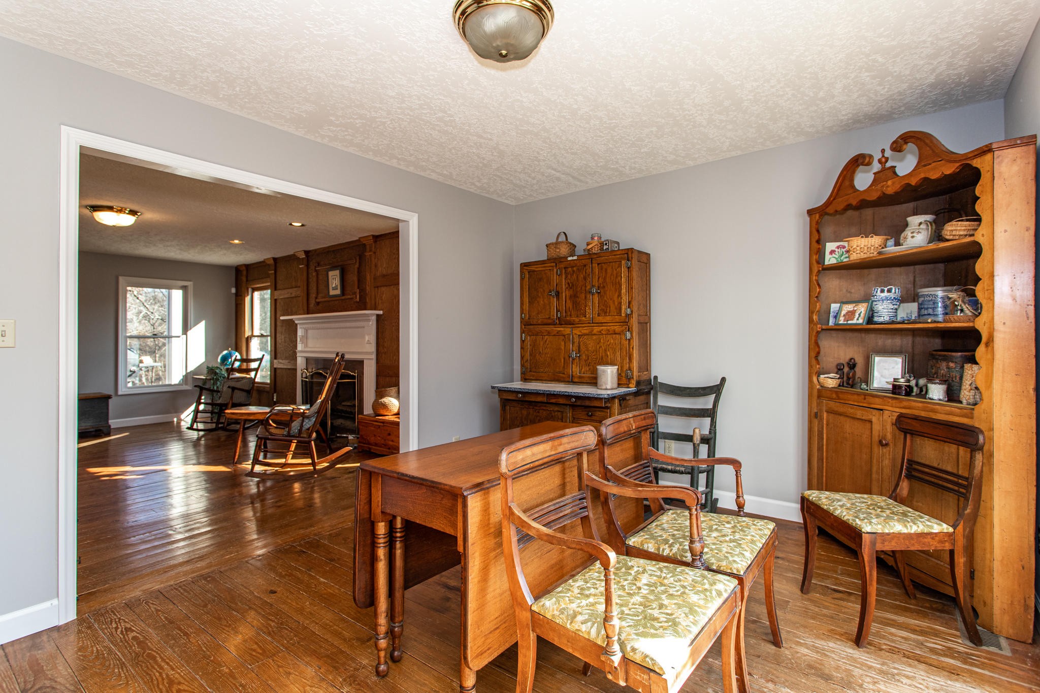 8026 Wood Road Corryton, TN 37721 - Photo 8 of 40 a view of a dining room with furniture and wooden floor