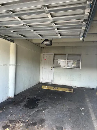 a view of a room with rack and a window