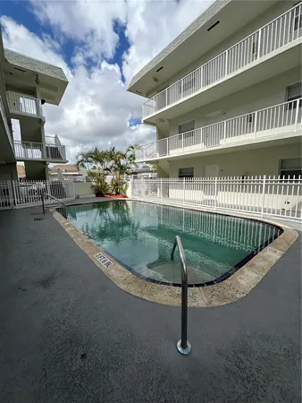a view of a swimming pool with a balcony